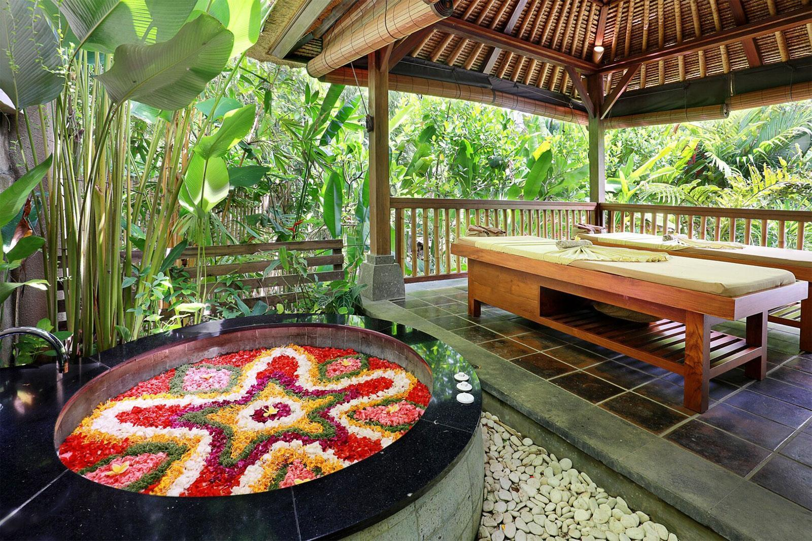 Private massage tables with Flower bath at Nyuh Bali Resort